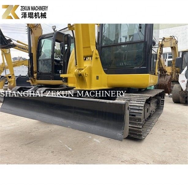 Mini excavadora Komatsu PC56-7 con 5 toneladas de peso operativo y motor diesel duradero
